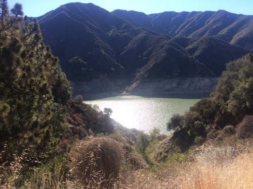 The welcome sight of water in the San Gabriel Reservoir, although you can see how the waterline has dropped significantly due to the drought.