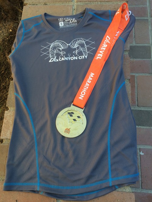 Flattering gray and blue shirt shown with my marathon finisher's medal